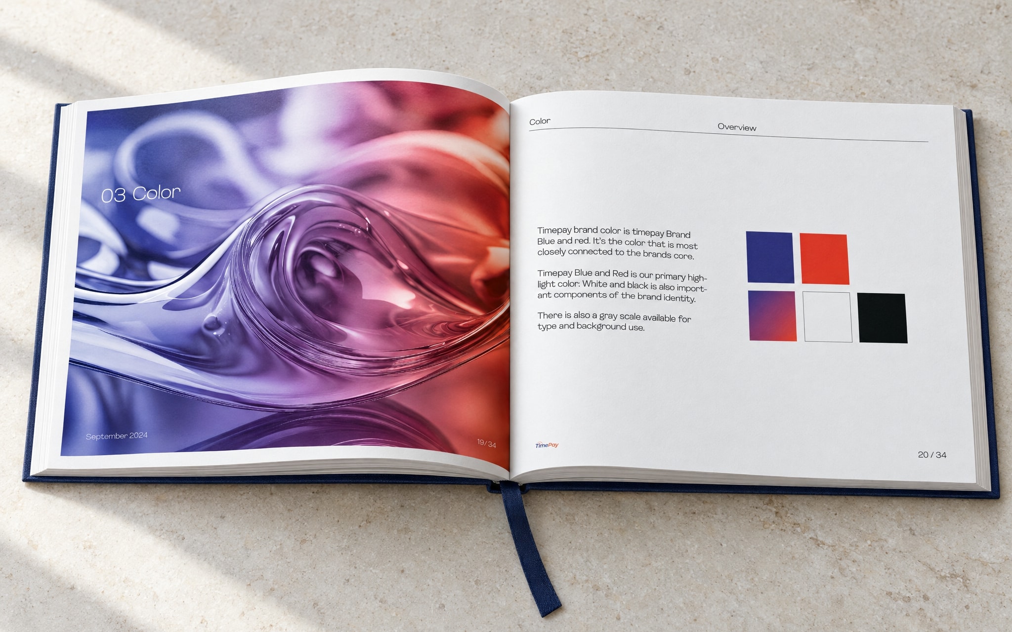 The book open at the colour chapter opener: a liquid navy-to-red image across the left page, the swatches on the right